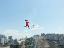 Showing one sticker from the Suatelier Sticker Sheet of a girl walking her dog. Also showing the transparent background.