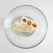 Cute bread and sandwhich sticker usage sample on two cut pieces of paper.