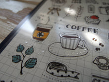 Another close up shot of the left side of Suatelier Daily Sticker Sheet with coffee, cup and leaf, coffee to go cup and tape.
