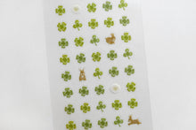 close up of Four Leaf Clovers and bunny Sticker Sheet