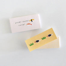 Cute sushi sticker usage example on small cut pieces of paper.