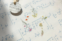 sample use of few flower stickers on a music sheet