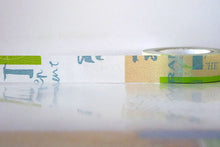 a roll of green / tan / blue graffiti light washi tape