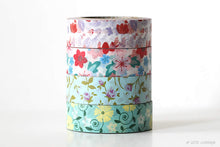 rolls of floral washi tape showing different colors and pattern